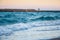 Sea coast in the evening and lonely figure of a man in the distance