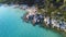 Sea coast with massive rocks and little sandy beach and amazing turquoise sea. Aerial view