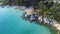 Sea coast with massive rocks and turquoise transparent clear sea. Aerial view