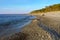 Sea coast with rocks, coastline stones and sand