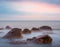 Sea coast with stones at the early morning