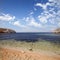 Sea coastline with foam, stones,