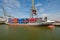 Sea container ship fully loaded in container terminal, Rotterdam