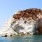 sea and dry bush rock alone in the sky santorini europe gre