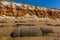 Sea eroded boulders in front of a chalk rock fall at the base of the cliffs at Old Hunstanton, Norfolk, UK