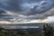 Sea of Galilee, Israel`s natural water sources, on a cloudy winter day of December with dramatic dark rain clouds scenery