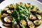 Sea and garden in one dish: clams with coriander and lemon