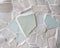 Sea Glass Mosaic Patterns made from Ocean Glass a lifestyle background with natural colours.