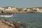 Sea gulf and fishing village on rocky coast. Cala Mesquida, Menorca, Spain