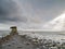 Sea gulls flying over ocean, Calm water surface. Land erosion by climate change, West coast of Ireland, Oranmore, county Galway