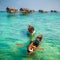 Sea Gypsy Kids on their sampan at their house on stilts