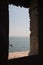 Sea and horizon line view from ancient medieval window