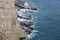 Sea of Japan seascape: transparent blue water, rocky coast in sunny autumn day. Russky island, Tobizina Cape, Vladivostok, Russia.