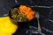 Sea kale Laminaria and carrot in black bowl