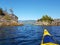 Sea kayaking on the blue waters of the Clayoquot Sound, Tofino on a sunny day