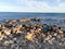 Sea lagoon with sea water surrounded by sharp cliffs and volcanic rocks