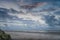 Sea landscape, clear blue cloudy sky on the beach, dutch landscape