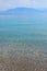 Sea landscape with pebbles and island in Turunc, Turunch Kumlubuk Mugla