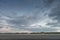 Sea landscape, during sunset, clear blue cloudy sky on the beach, Ameland Netherlands, dutch landscape
