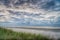 Sea landscape, during sunset, clear blue cloudy sky on the beach, Ameland Netherlands, dutch landscape