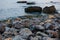 Sea landscape at sunset, stone coast and beautiful sky