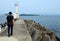 The sea and a lighthouse and angler of Wakayama