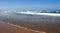 Sea long wave on a sandy beach