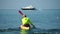 Sea man kayak. Athlete man swimming in sea on kayak at summer sunset. Healthy strong male enjoy outdoor active lifestyle