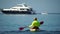 Sea man kayak. Athlete man swimming in sea on kayak at summer sunset. Healthy strong male enjoy outdoor active lifestyle