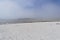 Sea mist rolls away from a beach in Brittany