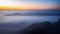 The sea of mist in the winter morning covers the village below in Li District, Lamphun Province, Thailand