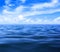 Sea or ocean water with blue sky and clouds