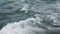 Sea or ocean waves and foam after motor boat or yacht