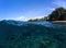 Sea panorama split photo. Undersea view of coral. Tropical island beach.