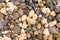 Sea pebbles. Small stones gravel background texture. A pile of pebbles on the beach. Texture, background for designer