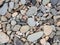 Sea pebbles. Small stones gravel texture background pattern.