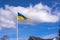 Sea pennant in Swedish flag colors on blue sky background. 6 June. Flag of Sweden waving high on the flagpole.