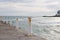 Sea pier. Anchorage for ships. A pier by the sea. Rusty posts by the sea.