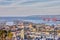 Sea port in the city of Haifa, panorama of the port and city buildings against blue sky with clouds