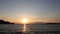 Sea port view, lighthouse, mountains and the opposite island of Samothrace in GÃ¶kÃ§eada, Imbros Island at sunset