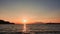 Sea port view, lighthouse, mountains and the opposite island of Samothrace in GÃ¶kÃ§eada, Imbros Island at sunset