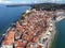 Sea resort cape with red roof houses Piran town