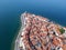 Sea resort cape with red roof houses Piran town