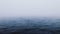 Sea ripple water with morning sunrise fog, ocean waves aerial view