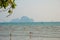 The sea and the rock in the distance. Krabi, Ao Nang, Thailand.