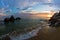 Sea rocks on a sandy beach at sunset in Sithonia, Chalkidiki