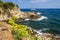 Sea and rocky coastline in Lloret de Mar on sunny summer day. Spanish seascape in Costa Brava