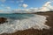 Sea rushing onto shingle beach