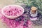 Sea salt, bottle of essential oil and lavender flowers.