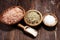 Sea salt in bowl. Crystals of salt on table and himalayan salt